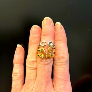Coach stackable Ring trio in silver, gold and rose gold. Size 6
